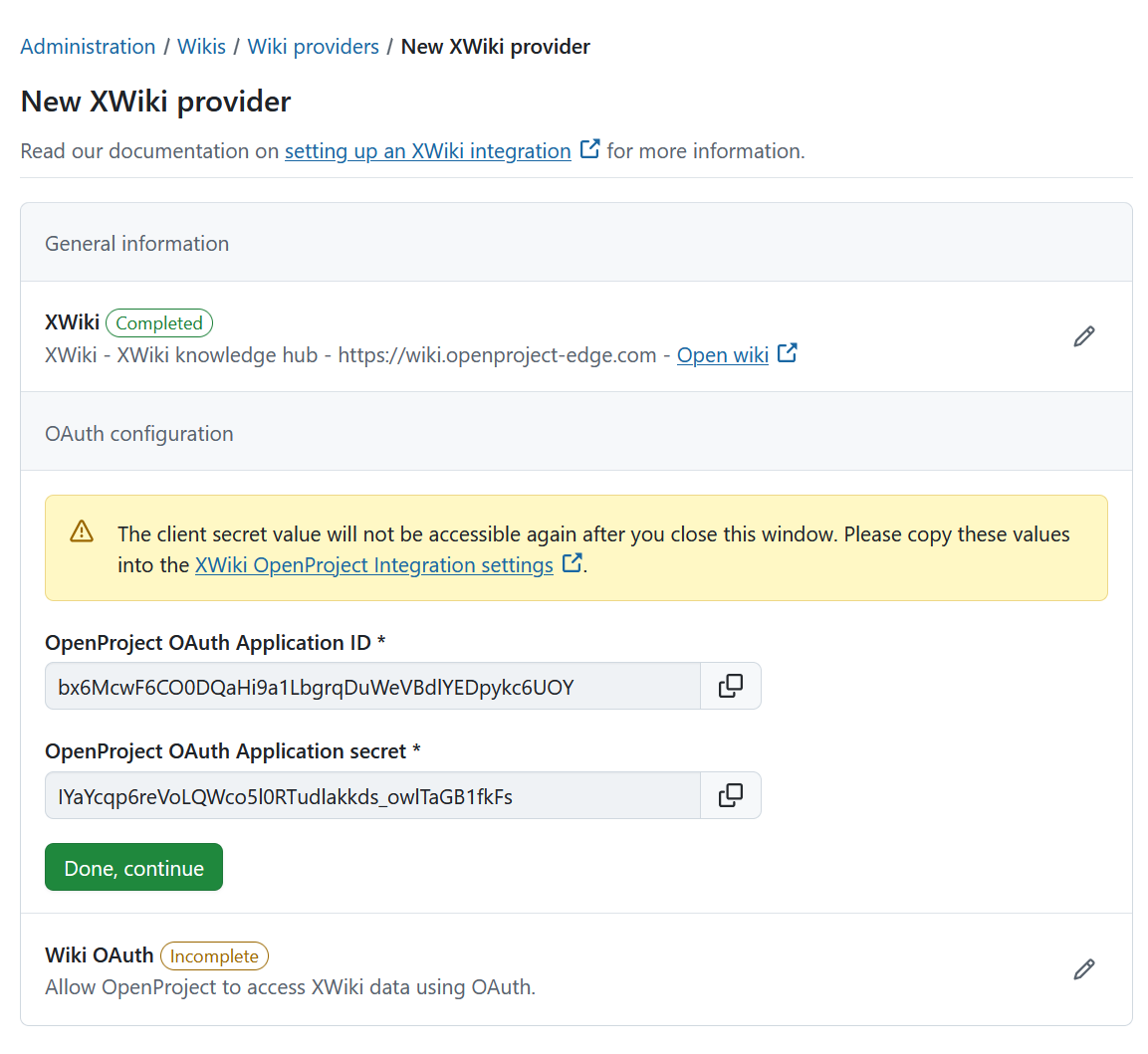 OpenProject OAuth application credentials showing the Application ID and Application secret